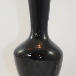 Classically-shaped black glass handblown vase