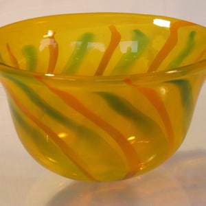 Hand blown &quot;old gold&quot; glass bowl with orange and green stripes