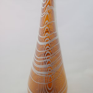 Tall handblown saffron glass vase with irregular white cross-hatching