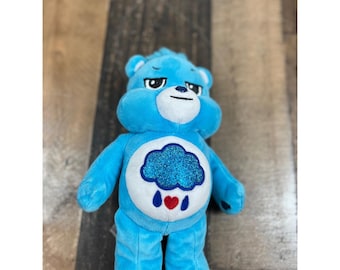 Care Bears Grumpy Bear Blue Plush 2022 Basic Fun Rain Cloud Glitter Belly Badge