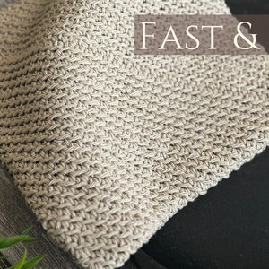 May include: A close-up of a beige knitted fabric with a textured pattern. The fabric is folded and has a "FAST & EASY" label.