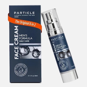 May include: A navy blue box and bottle of Particle Men's Formula Face Cream. The box has the text "Particle Aesthetic Science for Men" and "The Original 6 in 1". The bottle is silver and white with the same text. The product contains 1.7 fl. oz.