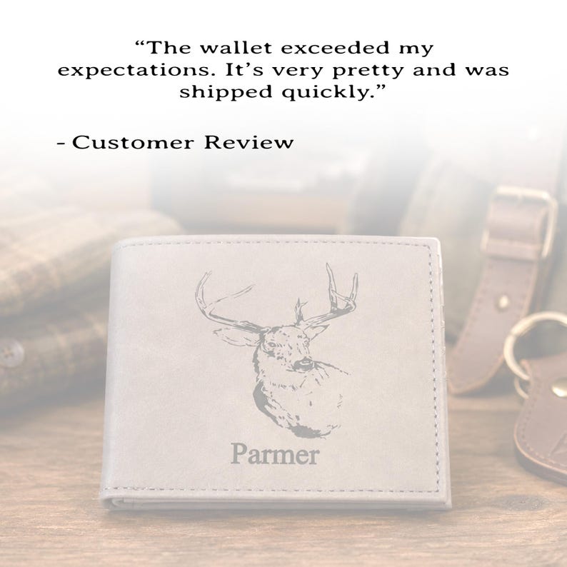 May include: A light gray bi-fold wallet featuring an engraved deer head illustration and the name Parmer. Above the wallet, text reads: The wallet exceeded my expectations. It&rsquo;s very pretty and was shipped quickly. - Customer Review.