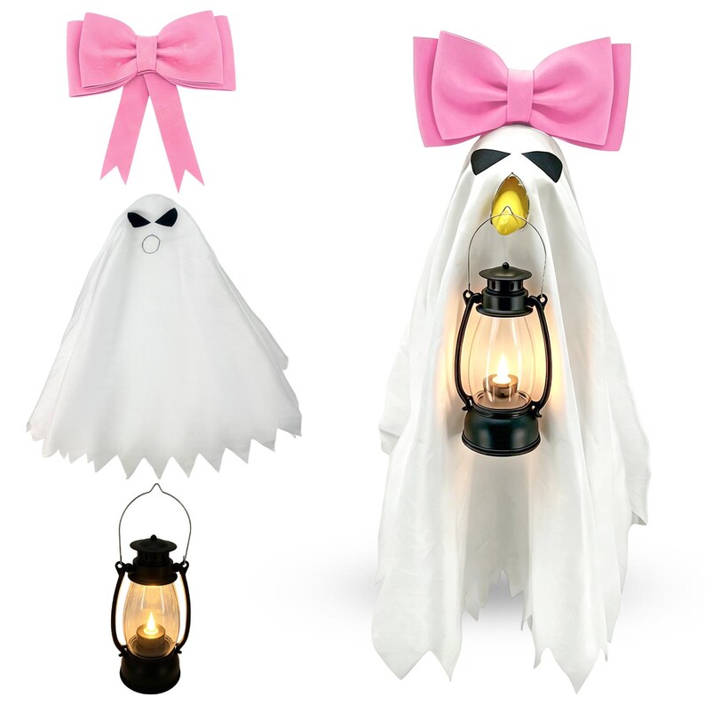 May include: A white ghost figure draped in fabric with black eyes and a yellow mouth, holding a black lantern with a glowing light. A large pink bow sits atop the ghost's head. A separate pink bow and a black lantern are also shown individually.