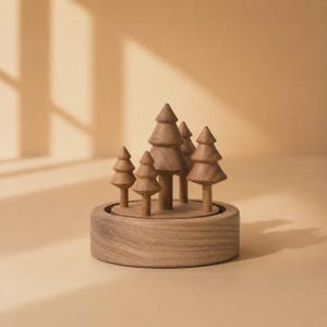 May include: A circular wooden base supports five carved wooden trees of varying heights. The trees feature tiered, conical shapes with smooth surfaces and visible wood grain, arranged in a cluster atop the round, thick wooden platform.