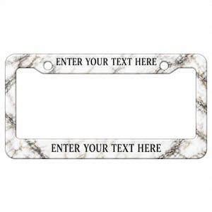 May include: A rectangular license plate frame featuring a white and grey marble pattern with black veining. The frame includes two mounting holes at the top and the black text ENTER YOUR TEXT HERE printed on both the top and bottom horizontal bars.