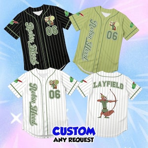 May include: Three baseball jerseys in black, light green, and white with pinstripes. Each features the text Robin Hood, the number 06, and a fox character graphic. One white jersey shows the name Layfield and a fox character aiming a bow and arrow.