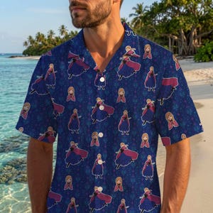 May include: A short-sleeved button-down shirt in dark blue featuring an all-over repeating pattern of the character Anna from Frozen. The design includes various poses of the character in her signature purple and blue outfit against a starry background.