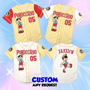May include: Four baseball jerseys featuring Pinocchio graphics. The shirts have cream pinstriped fabric, red or white sleeves, and the text Pinocchio and 05 on the front. One jersey displays the name Jaelyn on the back with a Pinocchio character illustration.