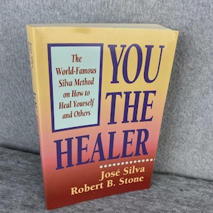 May include: A paperback book titled "YOU THE HEALER" by José Silva and Robert B. Stone. The cover features a gradient of colors from yellow to red, with the title in large, bold letters. The book's subtitle is "The World-Famous Silva Method on How to Heal Yourself and Others."