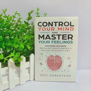 May include: A paperback book titled Control Your Mind and Master Your Feelings by Eric Robertson. The white cover features black and orange text, a subtitle about breaking overthinking, and a central illustration of a pink brain outline.