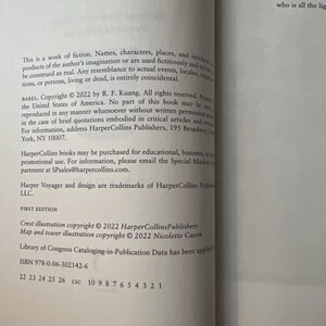 May include: A page from a book with text about copyright, publishing information, and the ISBN. The text includes the title "BABEL" and the publisher HarperCollins. The page is white with black text.