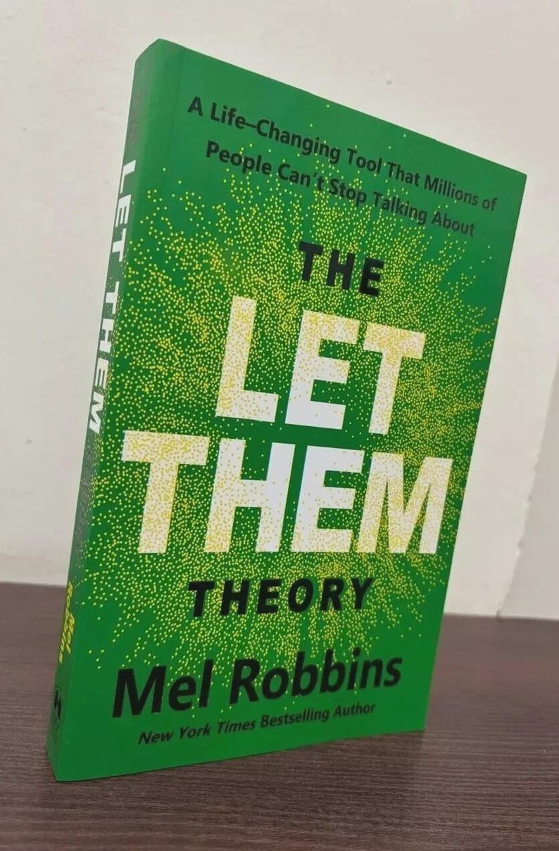 May include: A hardcover book titled "THE LET THEM THEORY" by Mel Robbins. The book has a green cover with white and yellow text. The cover also includes the text "A Life-Changing Tool That Millions of People Can't Stop Talking About."