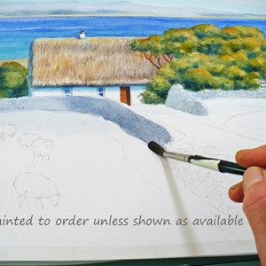 May include: Watercolor painting of a thatched-roof cottage with a stone wall and a path leading to the door. The painting is in progress, with sheep sketched in the foreground and a hand holding a paintbrush. The text "Painted to order unless shown as available" is at the bottom.