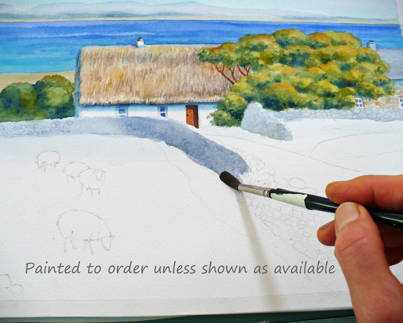 May include: Watercolor painting of a thatched-roof cottage with a stone wall and a path leading to the door. The painting is in progress, with sheep sketched in the foreground and a hand holding a paintbrush. The text "Painted to order unless shown as available" is at the bottom.
