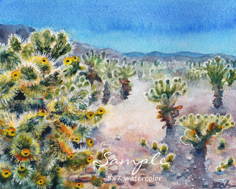 May include: Watercolor painting of a desert landscape with a cluster of cholla cactus in the foreground. The cactus are green with yellow flowers and are set against a background of blue sky and distant mountains. The painting is signed "Sample" and labeled "5x7 watercolor".