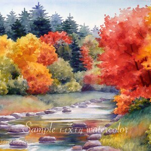 May include: Watercolor painting of a stream with rocks in the foreground and a forest with fall foliage in the background. The trees are a mix of green, yellow, and red. The painting is signed "Janet Zeh" in the bottom left corner and says "Sample 11x14 watercolor" in the bottom center.