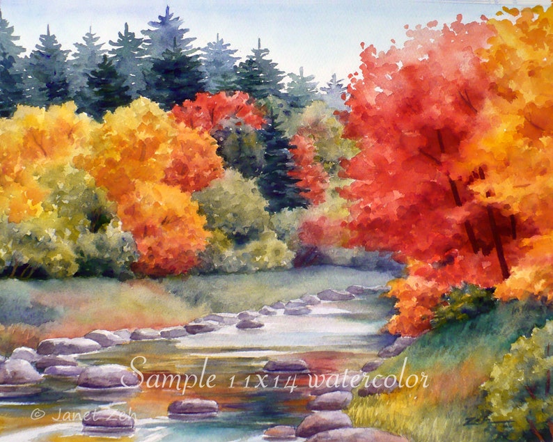 May include: Watercolor painting of a stream with rocks in the foreground and a forest with fall foliage in the background. The trees are a mix of green, yellow, and red. The painting is signed "Janet Zeh" in the bottom left corner and says "Sample 11x14 watercolor" in the bottom center.