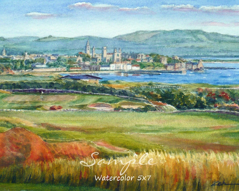 May include: Watercolor painting of a green golf course with a city skyline in the distance. The city is on a peninsula with a body of water separating it from the golf course. The sky is blue with white clouds. The painting is signed "Zeb" in the lower right corner and has the text "Sample Watercolor 5x7" in the lower center.
