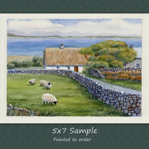 May include: Watercolor painting of a rural landscape featuring a thatched-roof cottage, stone walls, and grazing sheep. The scene includes a body of water and distant mountains under a cloudy sky. The text "5x7 Sample" is visible.