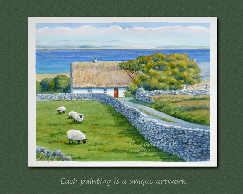 May include: Watercolor painting of a rural landscape featuring a white cottage with a thatched roof, stone wall, and grazing sheep. The painting includes a road, trees, and a body of water in the background. Text: Each painting is a unique artwork.