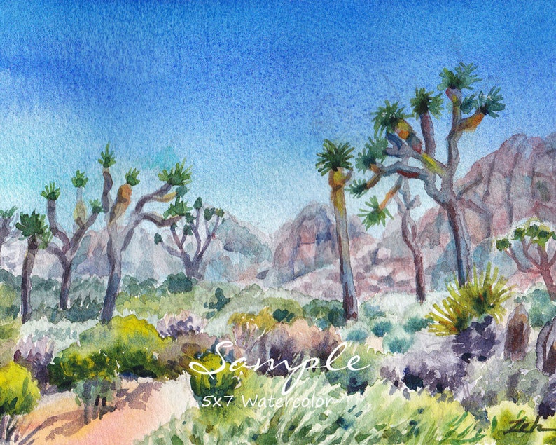 May include: Watercolor painting of a desert landscape with Joshua trees, a blue sky, and brown hills in the background. The painting is signed "Zeh" in the bottom right corner and includes the text "Sample 5x7 Watercolor".