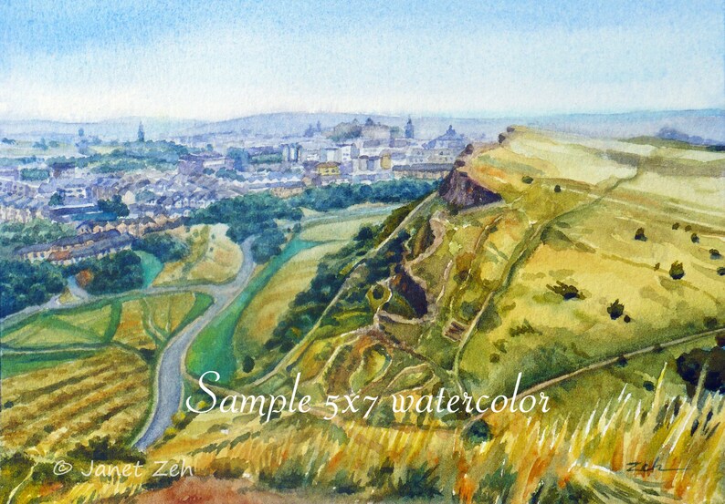 May include: A watercolor painting of a city skyline with a hill in the foreground. The city is in the distance and the hill is covered in green grass and trees. The sky is blue and there are clouds in the sky. The painting is signed "Janet Zeh" in the lower left corner. The text "Sample 5x7 watercolor" is written in the lower right corner.