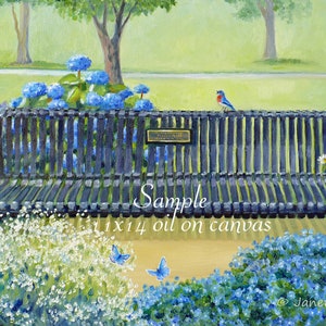 May include: A black metal bench with a plaque that reads "Memorial Bench" is surrounded by blue and white flowers. A bluebird perches on the back of the bench. Two blue butterflies fly above the flowers.