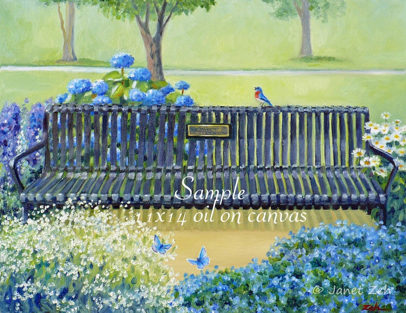 May include: A black metal bench with a plaque that reads "Memorial Bench" is surrounded by blue and white flowers. A bluebird perches on the back of the bench. Two blue butterflies fly above the flowers.