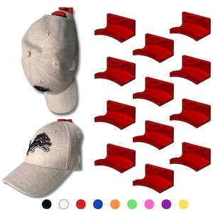 May include: Two gray baseball caps with the Detroit Lions logo, and a set of red hat racks. The caps have a curved brim and a red accent on the back. The hat racks are a vibrant red color.
