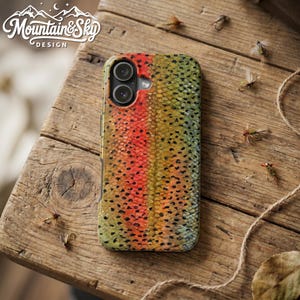 May include: A rectangular smartphone case featuring a detailed pattern of rainbow trout scales with a prominent red lateral stripe, black spots, and olive-green tones. The case includes a circular cutout for a dual-lens camera system.