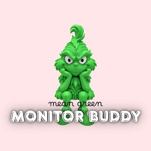 May include: A bright green figurine of a character with a tuft of hair, furrowed brows, and hands resting on its chin. The figure is sitting down. Below the figure, the text reads mean green MONITOR BUDDY in black and white lettering.