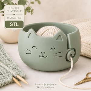 May include: A sage green cat-shaped yarn bowl featuring a smooth finish, a carved feline face, and a side slot for yarn. The image includes a digital file label with the text FICHIER NUMÉRIQUE, DIGITAL FILE, and STL, plus the text No physical item.