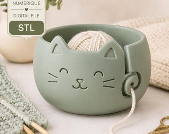May include: A sage green cat-shaped yarn bowl featuring a smooth finish, a carved feline face, and a side slot for yarn. The image includes a digital file label with the text FICHIER NUMÉRIQUE, DIGITAL FILE, and STL, plus the text No physical item.