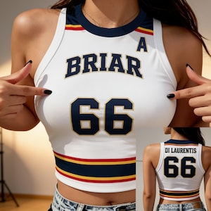 May include: A white sleeveless crop top with navy blue, red, and yellow trim. The front features the text BRIAR and the number 66 in navy blue with gold outlines. The back displays the text DI LAURENTIS and the number 66 in the same color scheme.