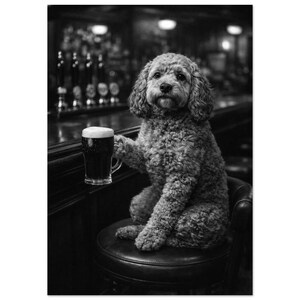 May include: A black and white photograph of a curly-haired dog sitting on a round bar stool. The dog is positioned next to a wooden bar counter and is holding a glass mug filled with a dark liquid, appearing to be a stout or dark beer.