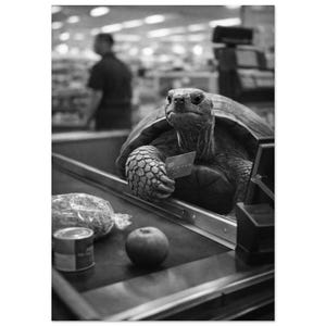 May include: Monochrome image of a tortoise at a supermarket checkout. The tortoise holds a credit card, with groceries including an apple and tinned goods on the conveyor belt. A person is blurred in the background.