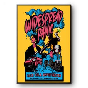 May include: A framed poster with a yellow background features the words "WIDESPREAD PANIC" in pink and blue. The poster includes illustrations of a woman, a man, a train, and a cityscape. The text "COCA-COLA AMPHITHEATER" is also visible.