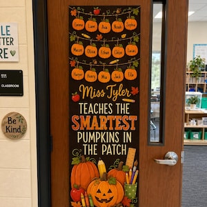 May include: A vertical classroom door sign with a black background featuring three rows of orange pumpkin illustrations, each labeled with a name. The text reads: Miss Tyler TEACHES THE SMARTEST PUMPKINS IN THE PATCH, surrounded by autumn leaves, pencils, and a ruler.