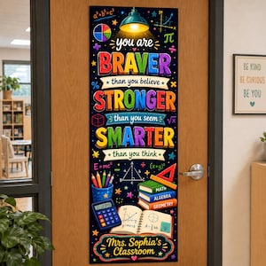 May include: A vertical classroom door banner with a black background featuring colourful text that reads: you are BRAVER than you believe STRONGER than you seem SMARTER than you think. It includes maths symbols, books, a calculator, and pencils.
