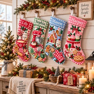 May include: Four personalized Christmas stockings hanging on a wooden rack, featuring red, green, blue, and pink gingham patterns. Each stocking displays embroidered names Lily, Sophia, Mason, and Harper, decorated with festive baking-themed motifs.