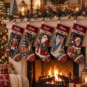 May include: Five personalised Christmas stockings hanging in a row, each featuring a deep red cuff with embroidered names: Hollis, Annie, Dad, Mom, and Taylor. The stockings display detailed holiday scenes including a nutcracker, deer, Santa, angel, and teddy bear.
