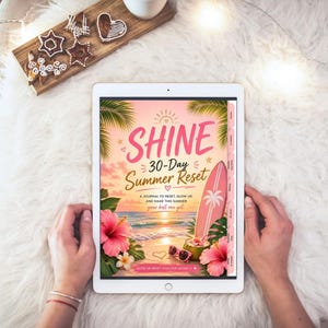 May include: A digital tablet displaying a journal cover titled SHINE 30-Day Summer Reset. The graphic features a beach scene with palm trees, a pink surfboard, hibiscus flowers, sunglasses, and a coconut drink against a sunset sky background.