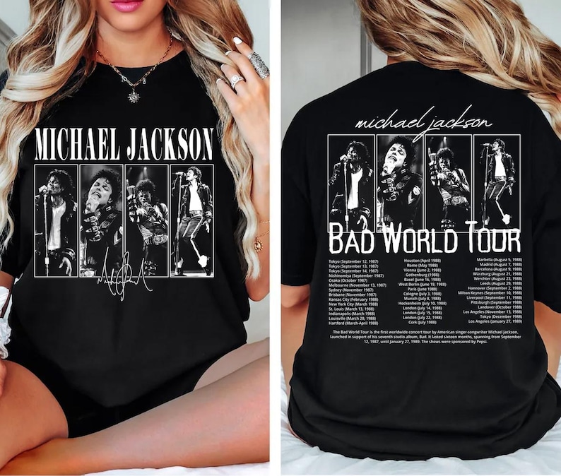 May include: Black t-shirt featuring a graphic of Michael Jackson with the text "MICHAEL JACKSON" on the front. The back of the shirt displays "BAD WORLD TOUR" with tour dates and images of Jackson.
