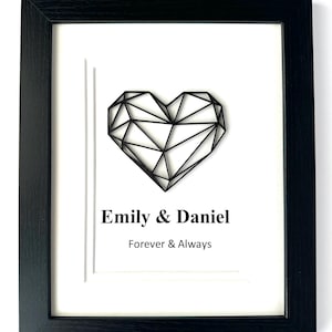 May include: A white ceramic mug with a black handle and the text "But First, Coffee" in a black, handwritten-style font. The mug is on a white surface.