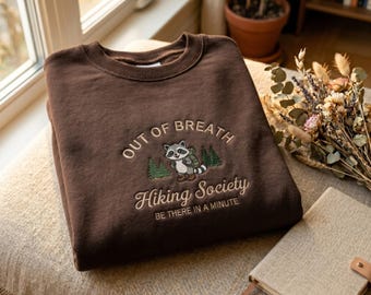Embroidered Raccoon Hiking Sweatshirt – "Out of Breath, Hiking Society" Graphic Tee