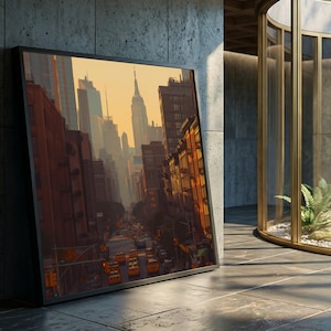 Puede incluir: Impresión artística enmarcada que representa una escena callejera de la ciudad de Nueva York al atardecer. La obra presenta una vista en perspectiva de edificios, taxis y el Empire State Building. La paleta de colores incluye tonos cálidos de naranja, marrón y amarillo.