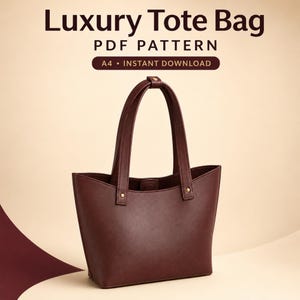 May include: A dark maroon tote bag with two vertical handles attached by gold-toned rivets. The text above reads Luxury Tote Bag, PDF PATTERN, and A4 • INSTANT DOWNLOAD. The bag features a smooth, solid-coloured exterior and a wide, open top.