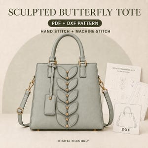 May include: A sage green tote bag featuring a vertical row of sculpted leaf-shaped appliques with gold-tone studs. The bag includes two top handles, a detachable shoulder strap, and a hanging luggage tag. Text reads: SCULPTED BUTTERFLY TOTE.