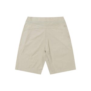 May include: A pair of beige shorts. The shorts have a high waist and a relaxed fit, with a visible seam down the center of the front and back. The fabric appears to be lightweight and slightly textured, suitable for warm weather.